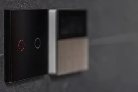 Black touch switch with illuminated red ring. Close interior view of wall c.. Stock Photos
