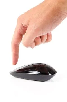 Black touch wireless modern computer mouse with finger isolated Stock Photos