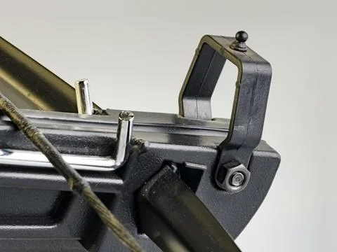A black training crossbow with a sleek design and a black string on a white.. Stock Photos
