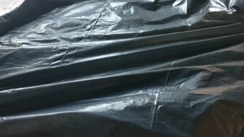 Black trash bag plastic background. plastic in motion for background. Stock Footage 226982655