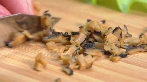 Black truffle cut with knife into cubes Stock Footage 73400848