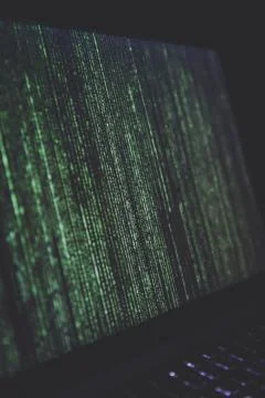 Black turned-on laptop with a web coding Foto stock