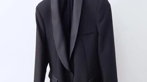Black Tuxedo Jacket on White- Crisp Contrast and Classic Form Video stock 312092175