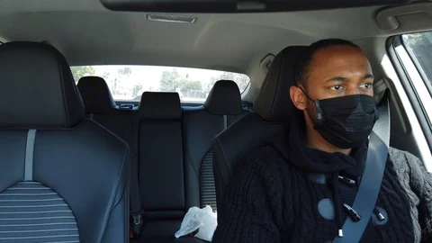 Black uber driver with face mask Stock Footage 128445932