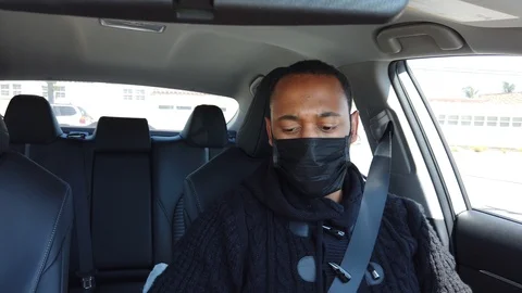 Black uber driver with face mask Stock Footage