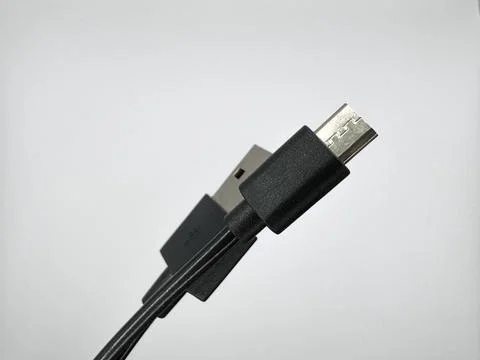 Black usb cable input and output on a white background in the center of the Stock Photos