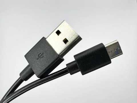 Black usb cable input and output on white background on the right in the image Stock Photos