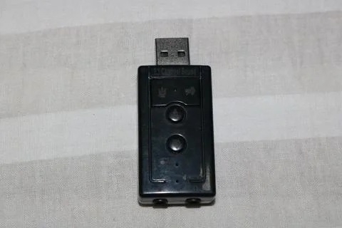 Black usb device with buttons on gray fabric background  small electronic g.. Foto stock