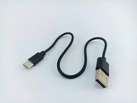 Black usb type c data cable on white background Stock Photos