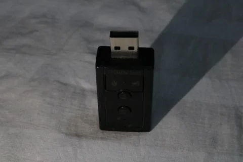 Black usb wireless adapter device on gray surface  small electronic gadget .. 스톡 사진