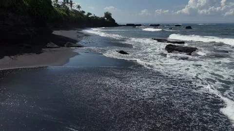 Black volcanic sand beach in Bali, 4K 25 fps, slow motion video, drone shoot Stock Footage 283329971