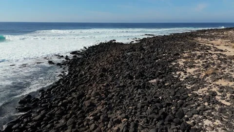 Black Volcanic Shoreline Borders Rolling Ocean Surf Along Lanzarote Coast Stock Footage 344023172