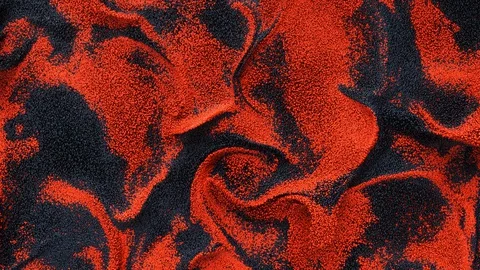 Black vs red caviar. Wavy multicolored particles of liquid turbulent flow. Video stock 127938144