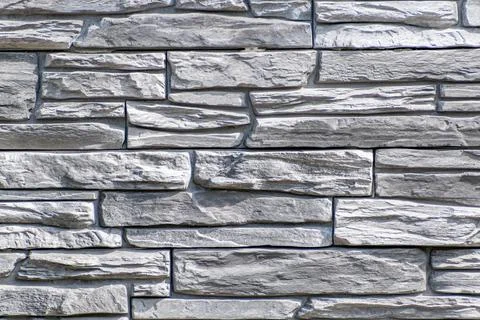 Black wall background Wall of gray stacked stones 스톡 사진