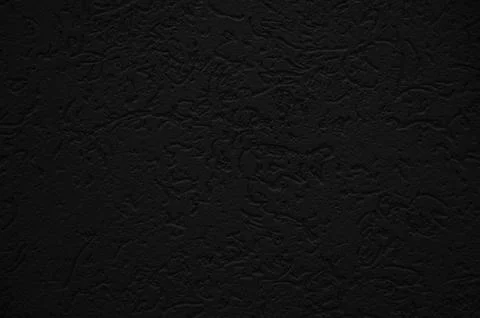Black wall close up. Abstract background of painted black wall. Stock Photos