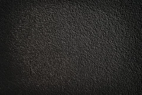 Black wall with decorative plaster texture background Stock Photos