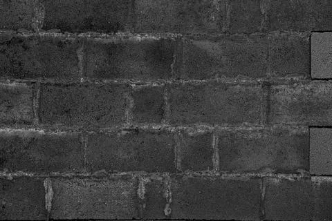 The black wall is made of stone. Stock Photos