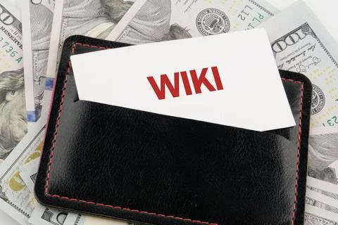 A black wallet includes a card that reads Wiki, surrounded by hundred dollar  Stock Photos