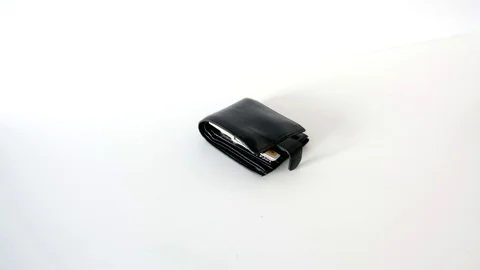 Black wallet on a white background cast table isolation Stock Footage 109196923