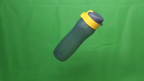 Black water bottle on green screen background Stock Footage 314670284