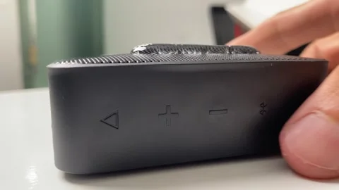 Black waterproof portable bluetooth speaker. Dumping water Video stock 250321144