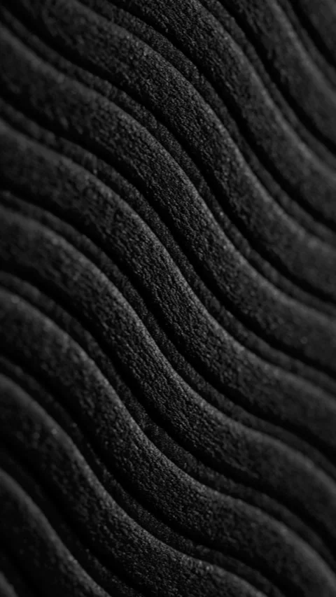 Black wavy ribbed texture slow pan. Stock Footage 339202522