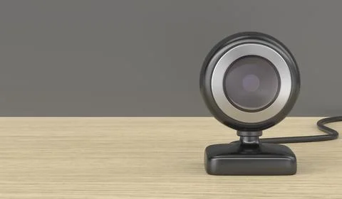 Black web camera on wooden desk Stock Illustration