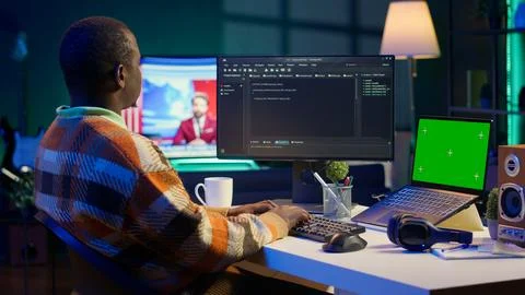 Black web developer handling database servers for safety with green screen Stock Photos