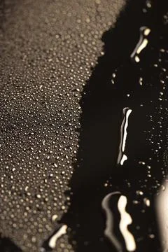 Black wet surface covered with a large number of water droplets black surface Stock Photos