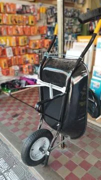 Black Wheelbarrow Displayed In Hardware Store Stock Photos