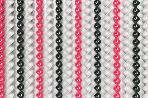 Black, white and red plastic spiral sticks on white background Stock Illustration