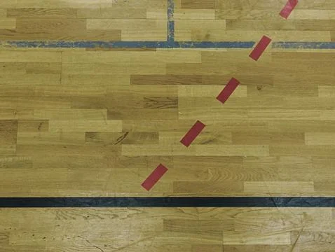 Black, white and red solid or dotted lines in hall playground. Worn out woode Stock Photos