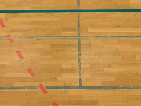 Black, white and red solid or dotted lines in hall playground. Worn out woode Stock Photos