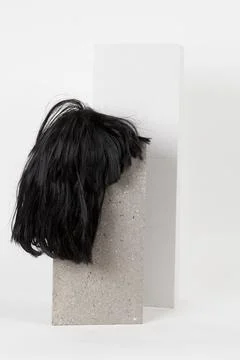 Black wig cinder block Stock Photos