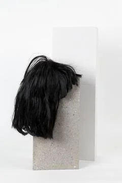 Black wig cinder block Stock Photos