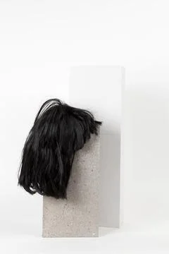 Black wig cinder block Stock Photos