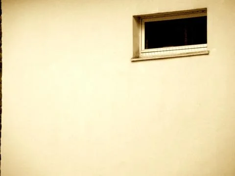 Black window in wall of building Foto stock