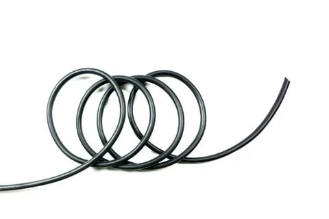 Black wire cable isolated on a white background abstraction. Stock Photos