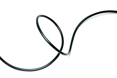 Black wire cable isolated on a white background abstraction. Stock Photos