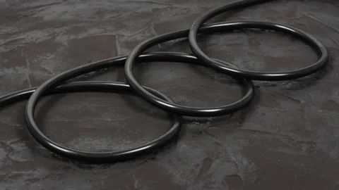 Black wire isolated on black and texture background. Side view. Loop motion. Stock Footage 168533977