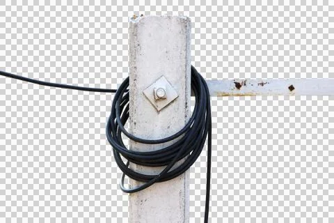 The black wire is long rolled on a cement pole isolated on white background. Stock Photos