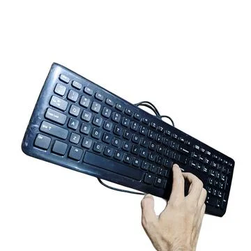 Black wired computer keyboard held by hand on white background 스톡 사진
