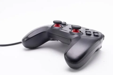 Black Wired Game Controller with Red Accents on White Background, Gaming De.. Stock Photos