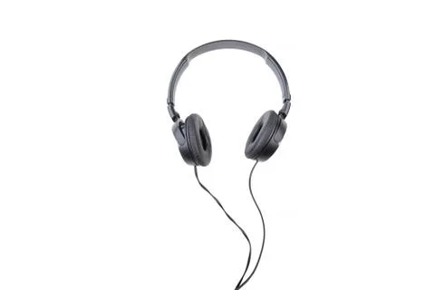 Black wired headphones on a white background. Stock Photos