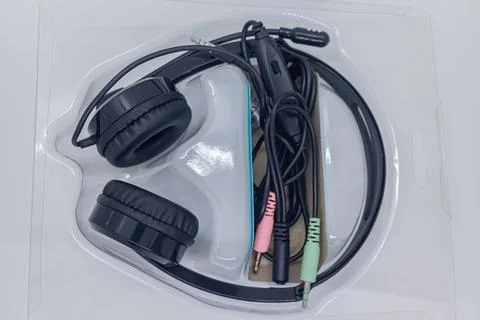 Black Wired Headset with Microphone in Plastic Packaging on White Studio Bac Stock Photos