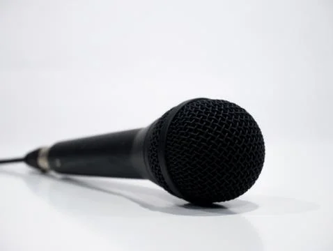 Black wired microphone on white background Stock Photos