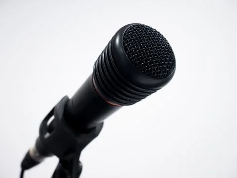 Black wired microphone on white background 库存照片