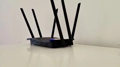 Black Wired Router with Six Antennas and Blue Indicator Light Stock Footage 333230063
