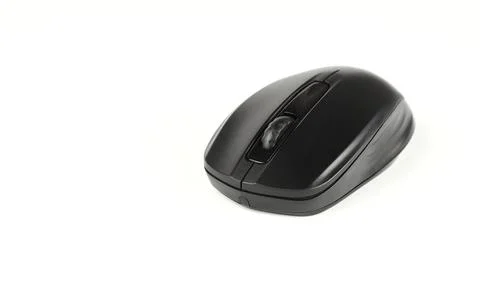 Black wireless computer mouse on a white background. 库存照片