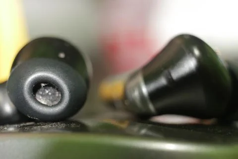 Black Wireless Earbuds Close-Up Stock Photos